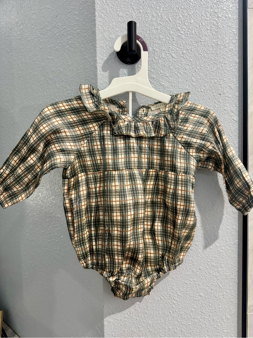 Noralee ruffled onesie. Never worn. 3-6 months.